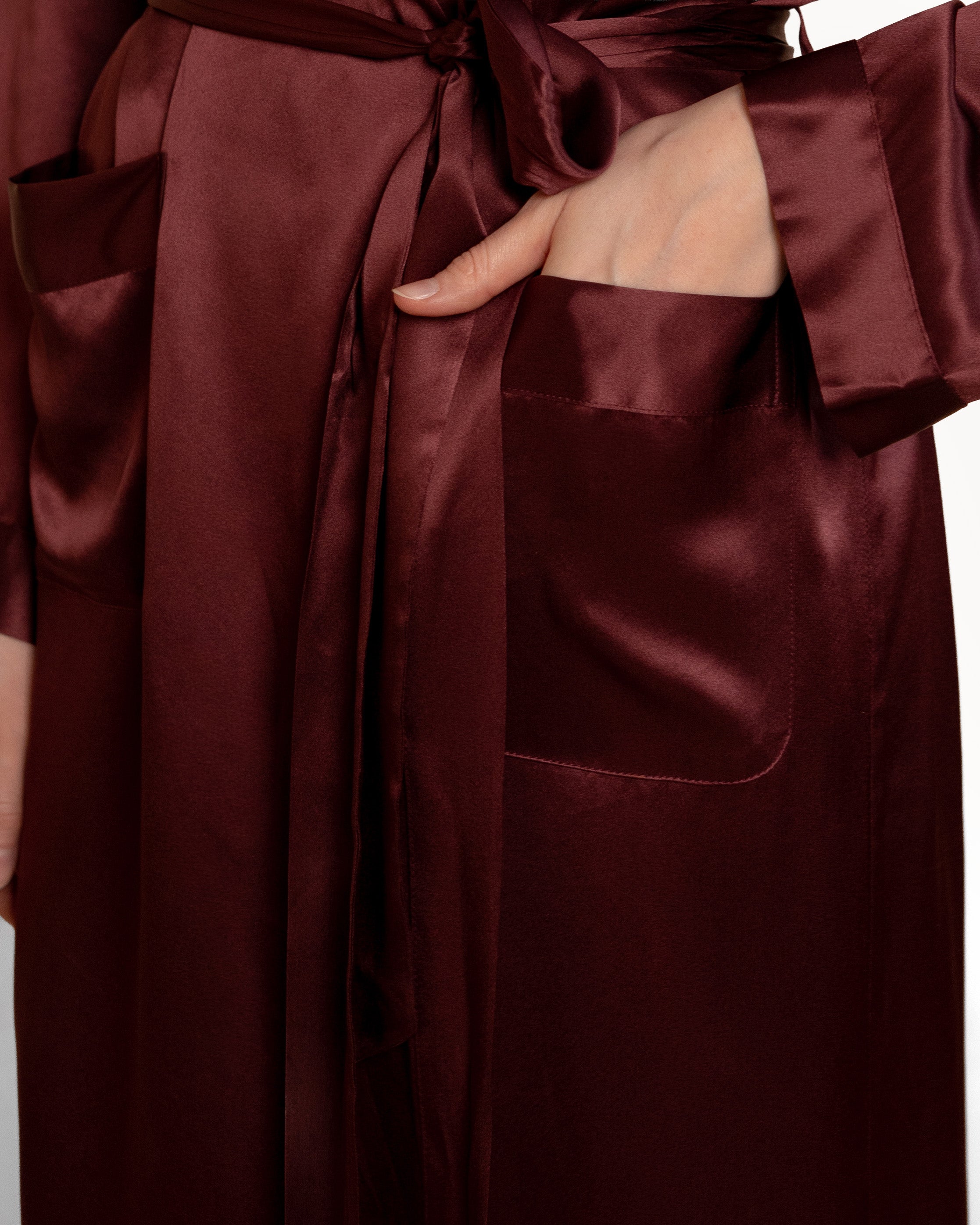 Pocket shot of Wine NORA silk robe, functional and elegant silk robes in mulberry silk fabric.