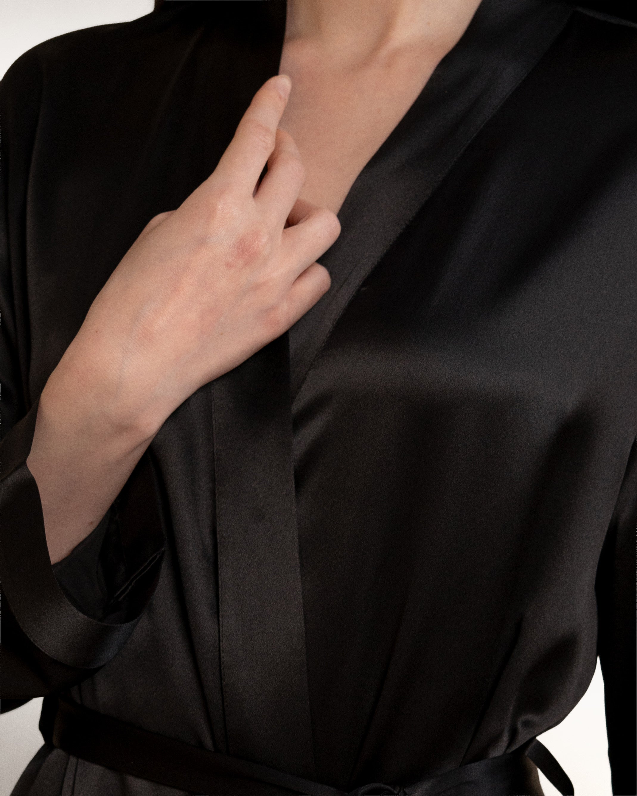 Close-up of NORA black silk robe collar, premium womens silk robes detail in mulberry silk fabric.